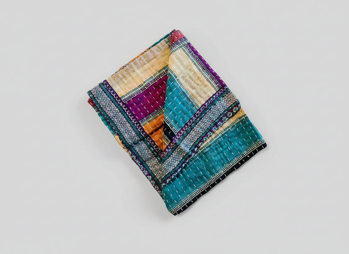 A colorful Kantha kitchen towel with geometric patterns 