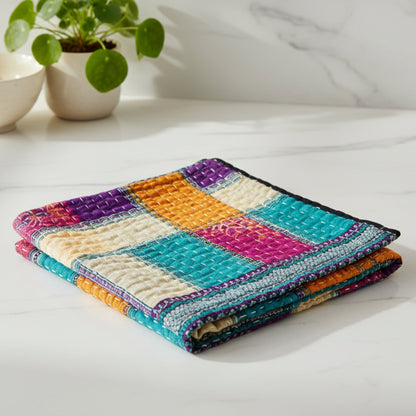 A colorful Kantha kitchen towel with geometric patterns 