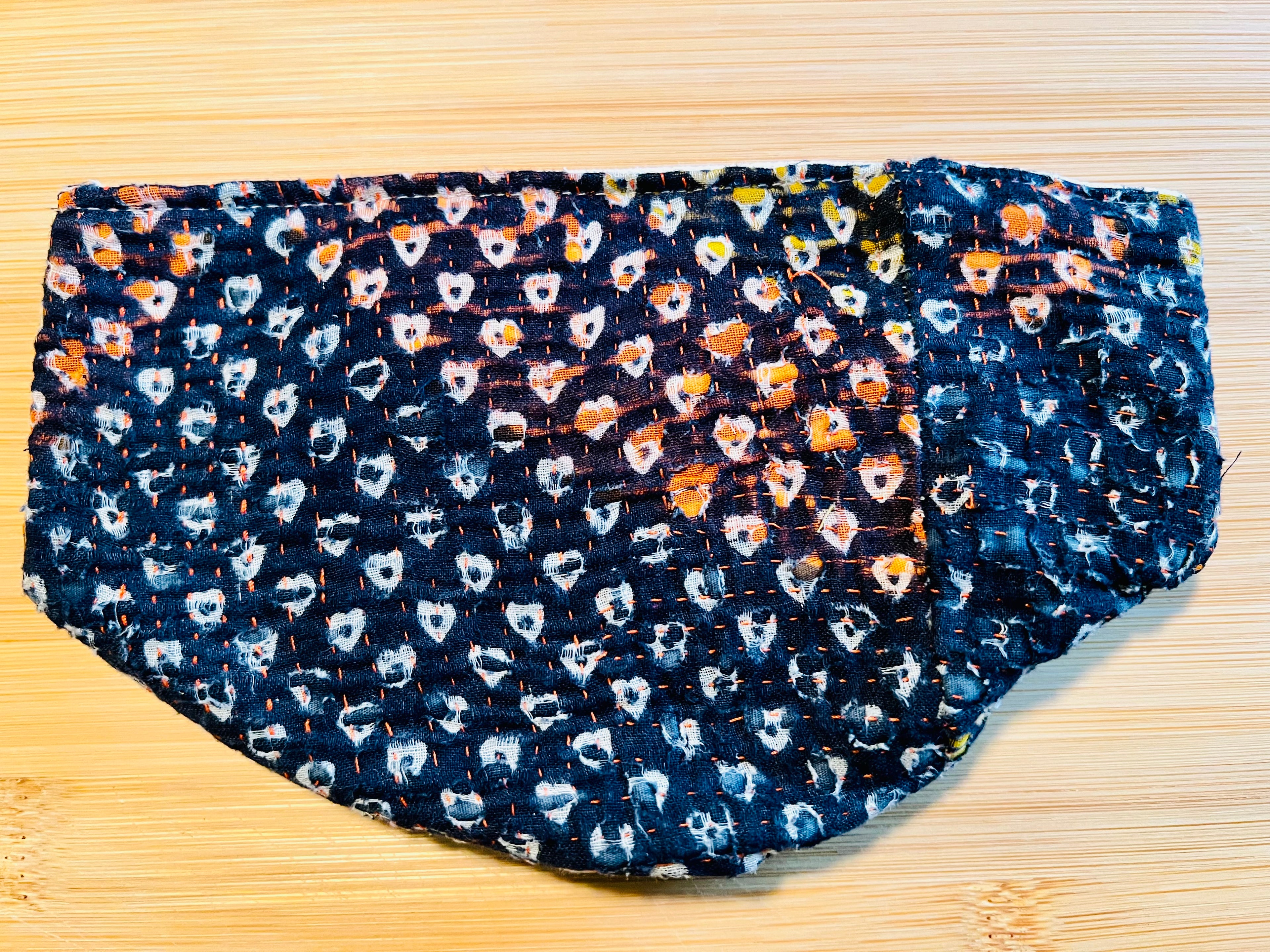 Heart patterned pouch on a wooden surface