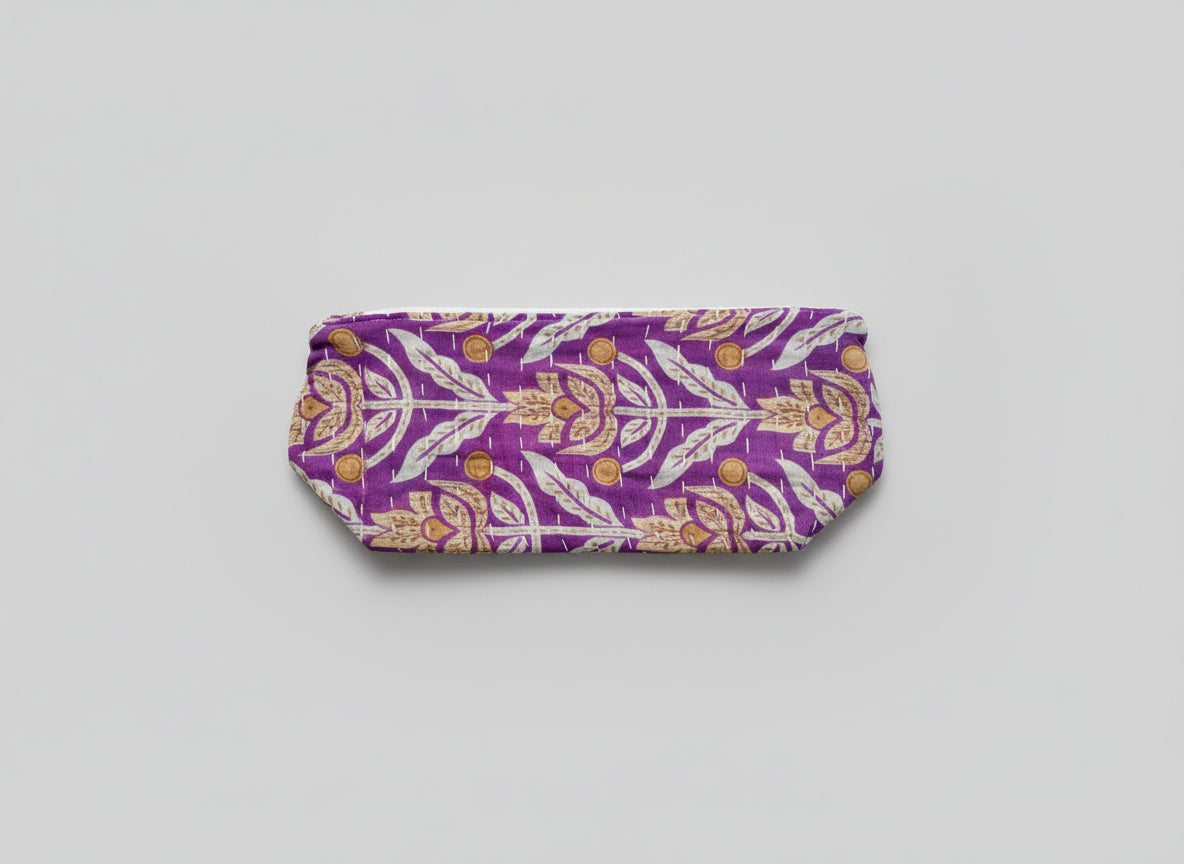 A large zippered Kantha cosmetic bag with deep purple colors and floral accents.