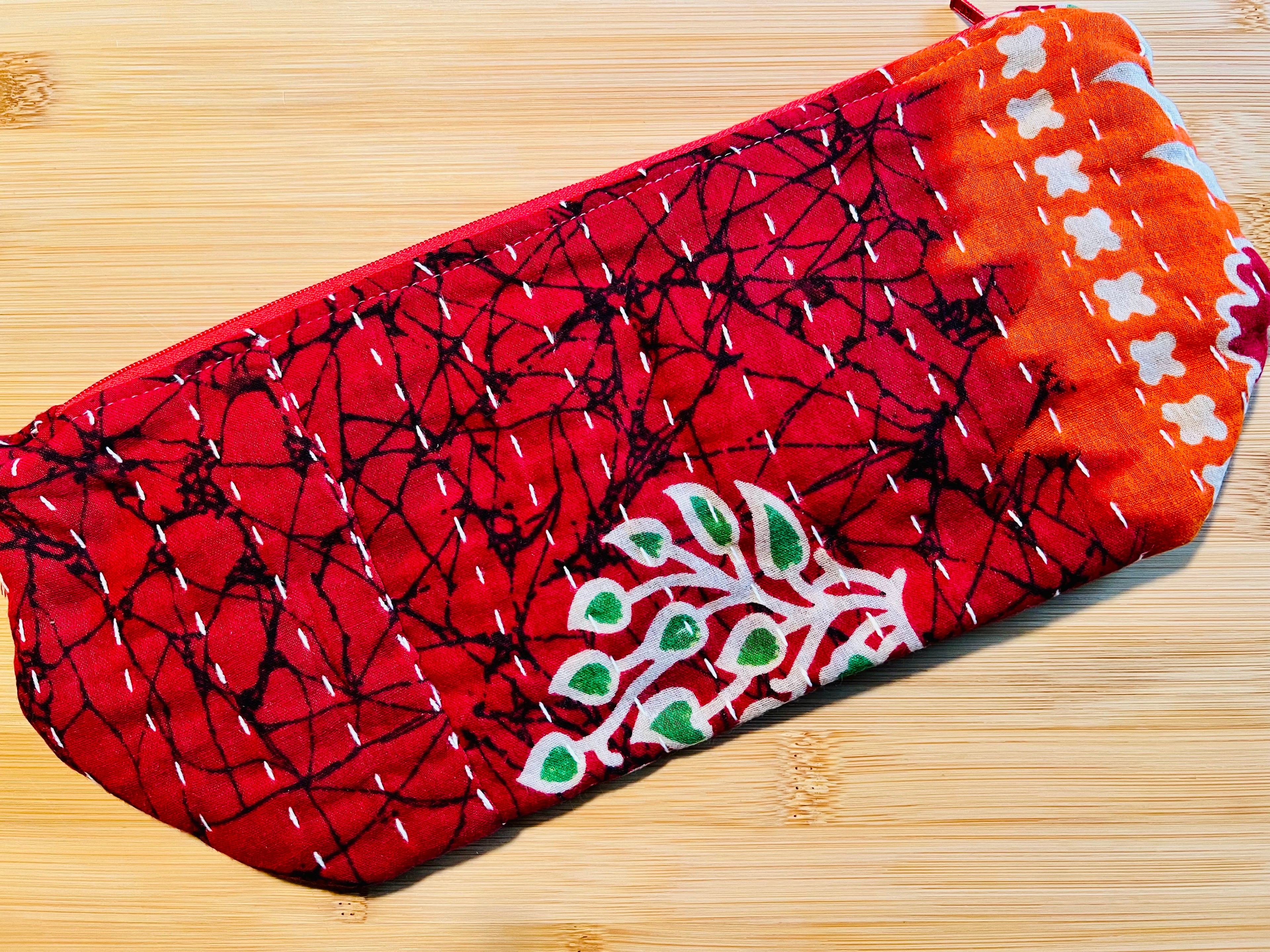 Red patterned fabric on a wooden surface
