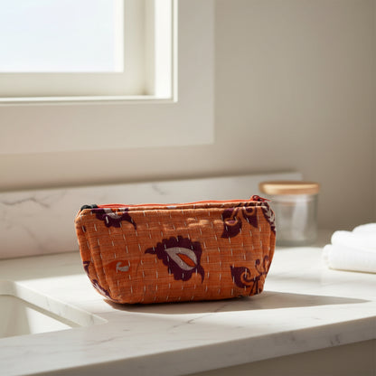 Medium size Kantha zippered pouch in various colors with floral designs.