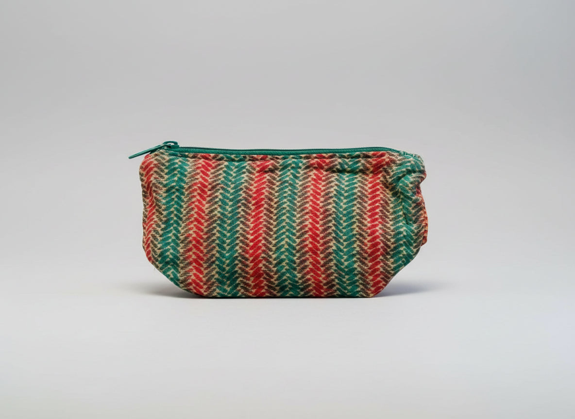 Herringbone design Kantha cosmetic zippered pouch made from artisans is featured on a neutral background.