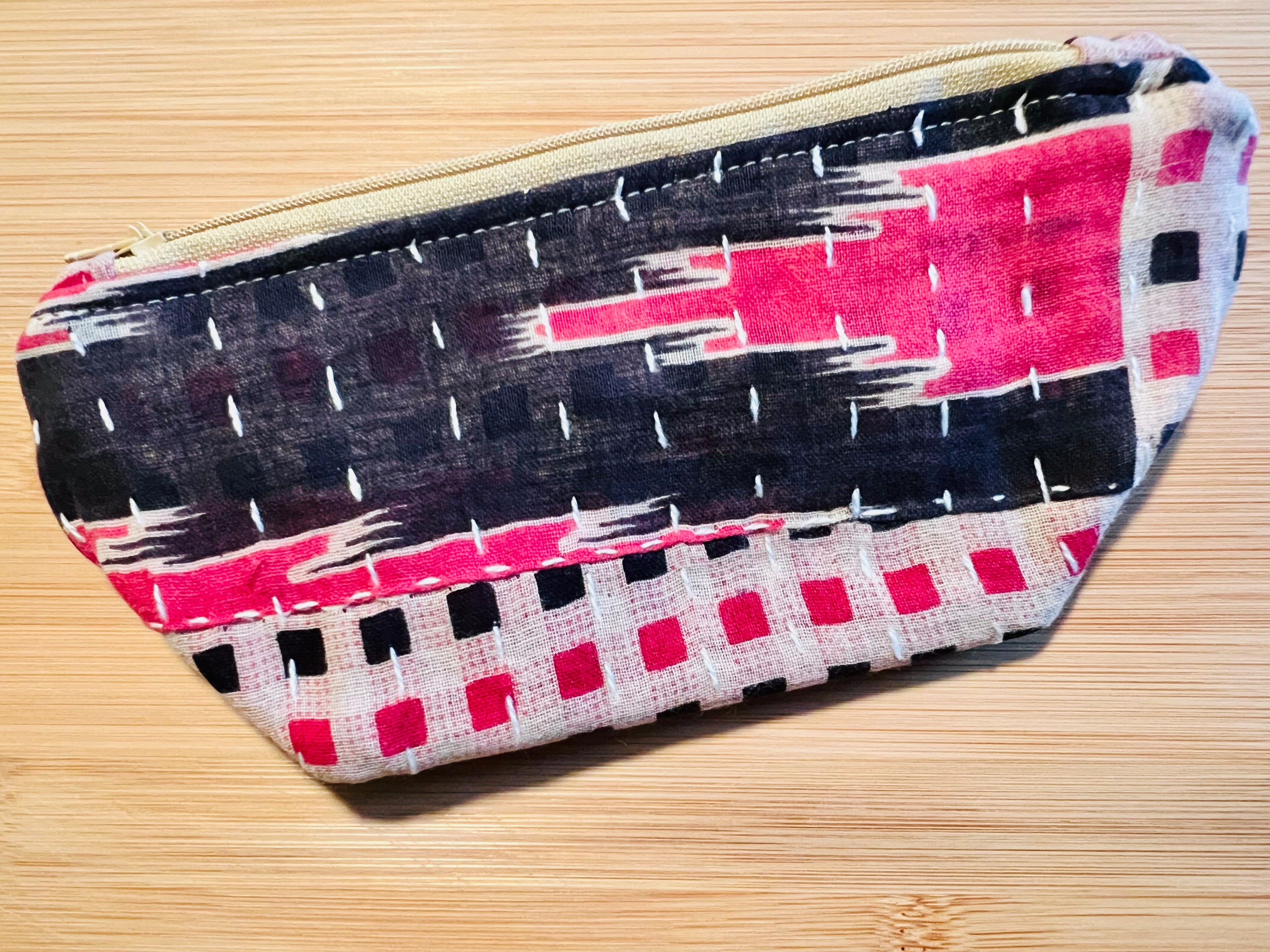 Black & Pink abstract pattern on a recycled fabric pouch