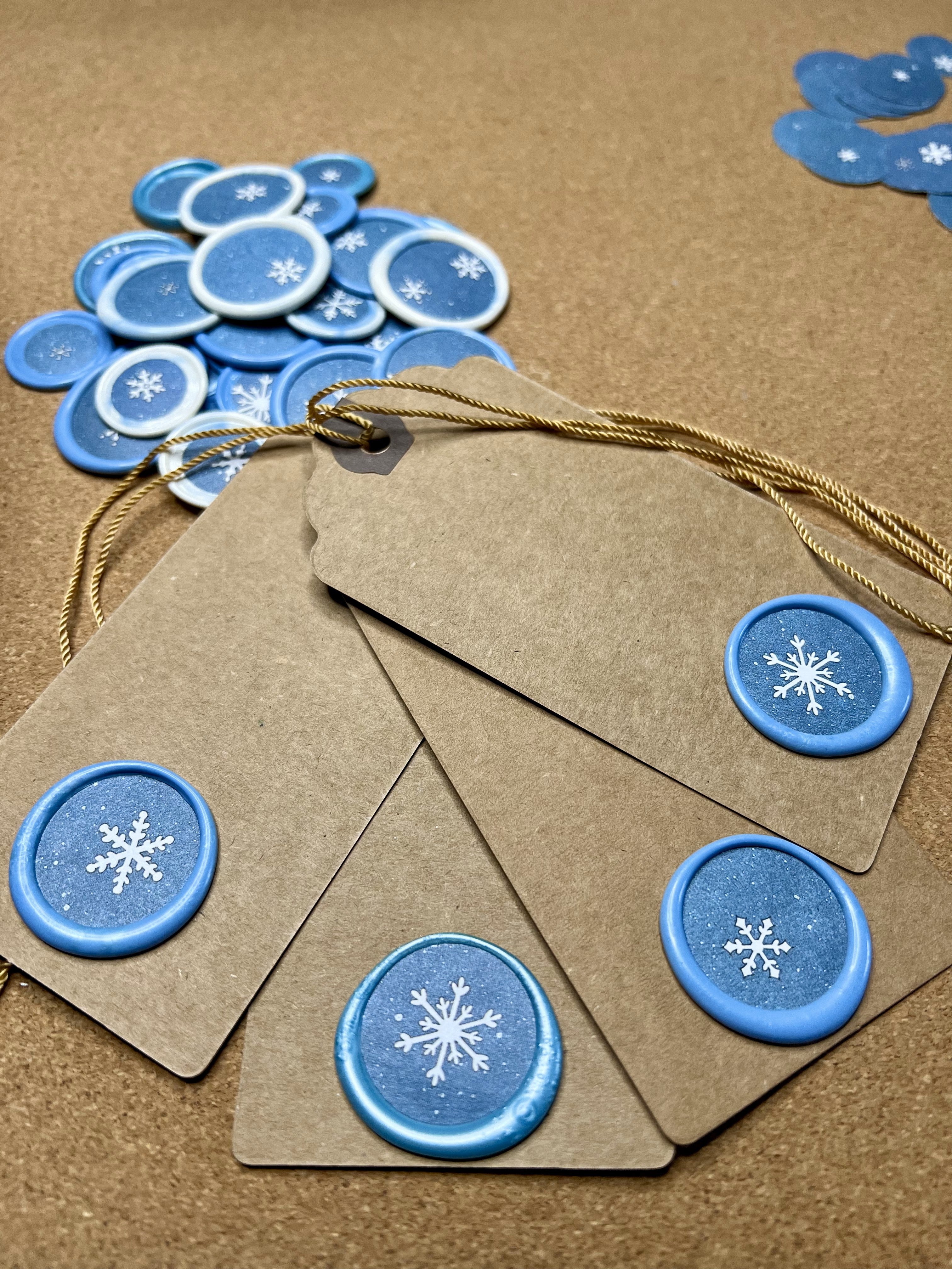 Close-up of white snowflake wax seal on rustic kraft tag
