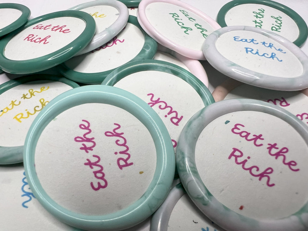 Sassy wax sticker with anti-capitalist flair, perfect for laptops, journals, or protest signs.