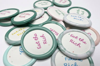 Sassy wax sticker with anti-capitalist flair, perfect for laptops, journals, or protest signs.