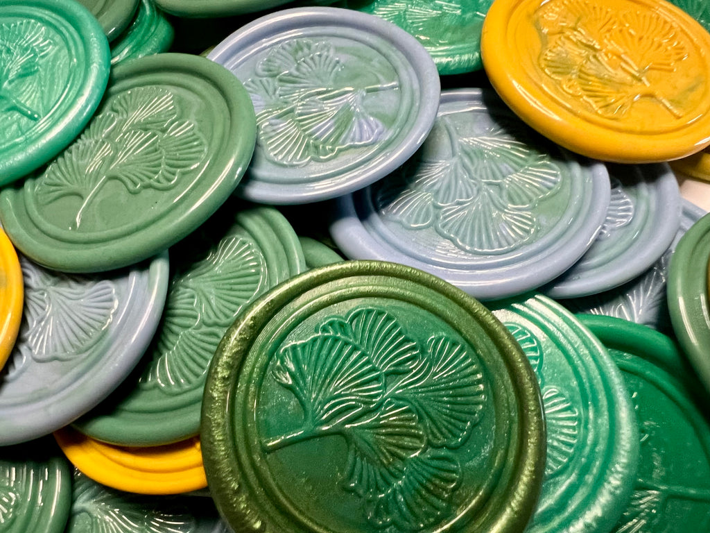 Set of 10 wax seals with a delicate ginkgo leaf design in earthy tones.
