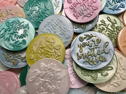 Handcrafted “You’re Invited” wax seals add a polished, personal touch to any party invitation.
