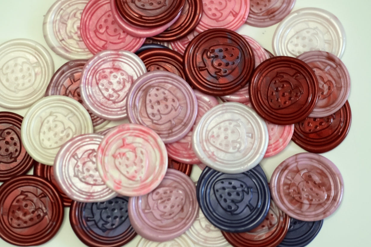 Strawberry embossed wax seal stickers created by Rochambeau Home in berry color themes.