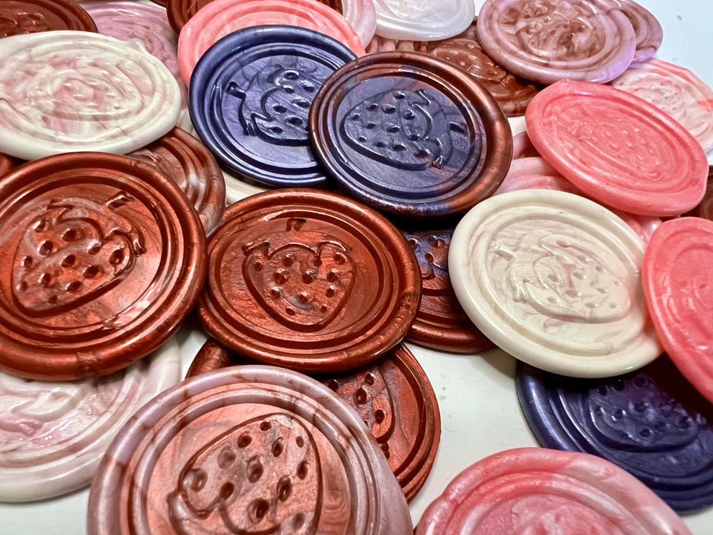 Sweet strawberry-shaped wax seal perfect for adding fruity charm to envelopes.