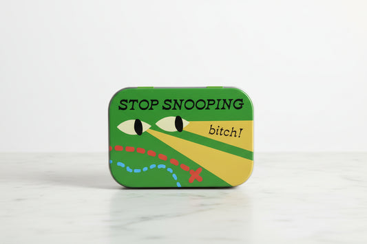 Small green tin with a alligator design and text, 'Stop Snooping Bitch!" on a white background