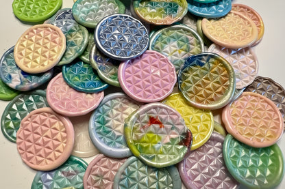 Collection of colorful and prism wax seal stickers with geometric patterns on a white background