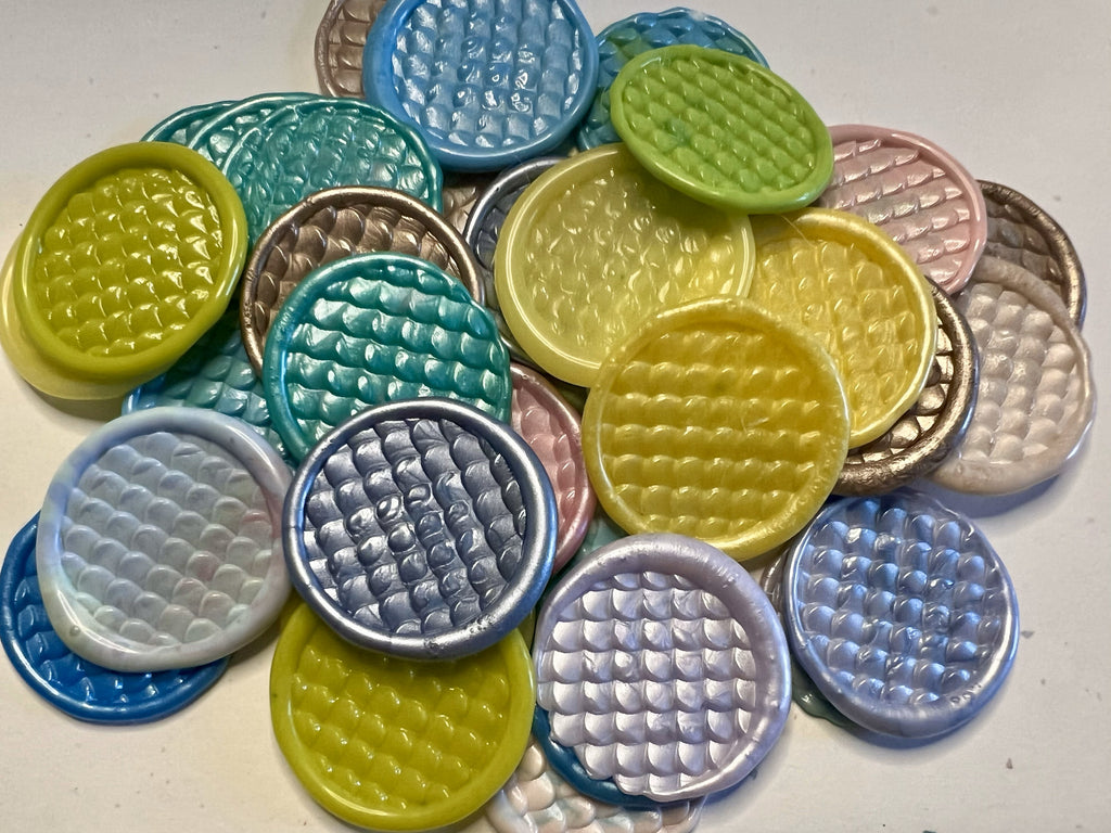 This close up view of the Hiss & Tell wax seal stickers showcases the three dimensional sticker