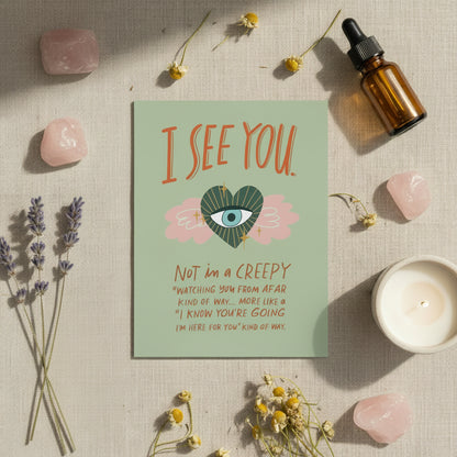 Card with 'I See You' text flat lay on a neutral textured background