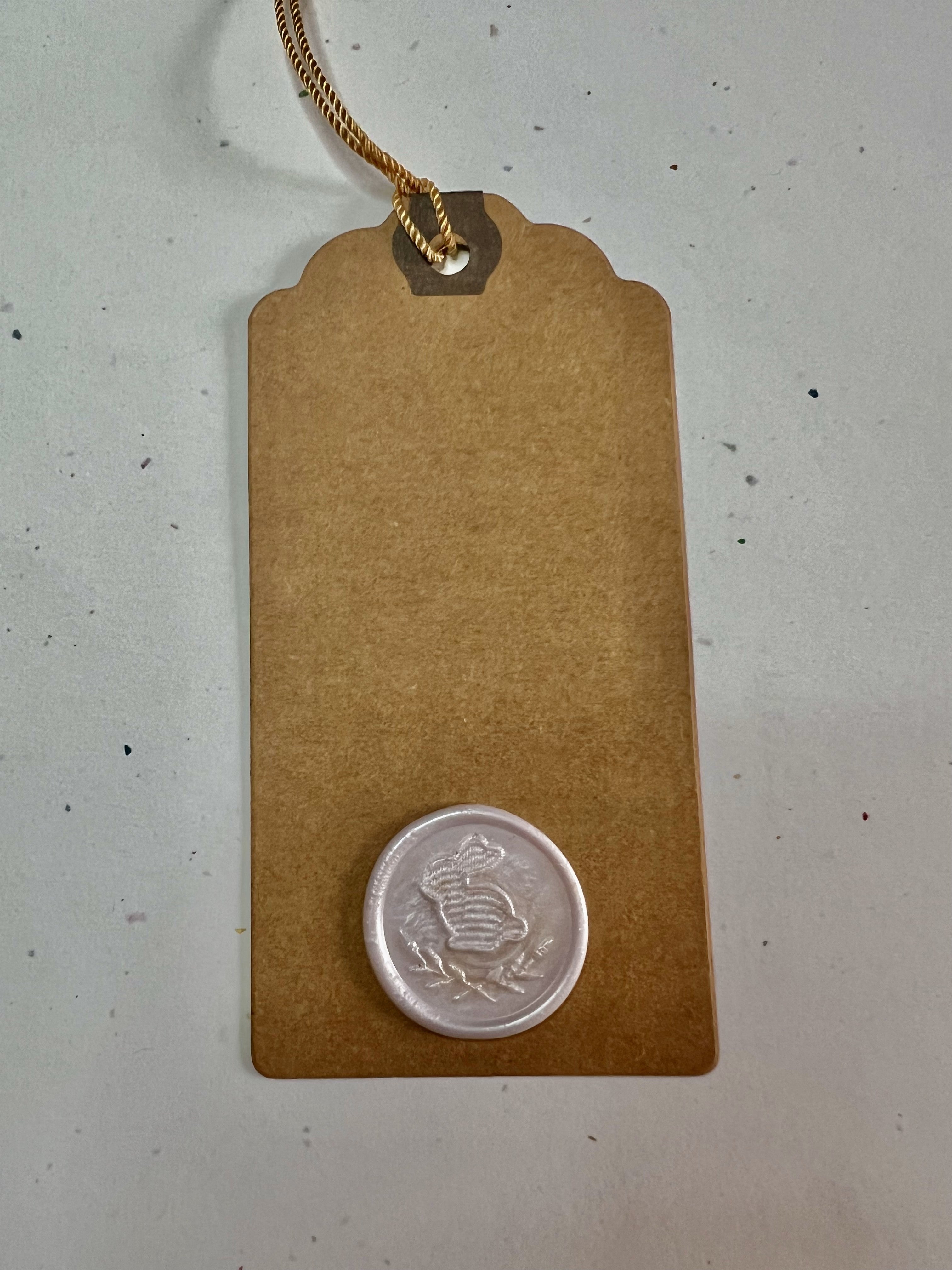 Handcrafted Easter tags featuring matching wax seals and customizable earthy-toned finishes.