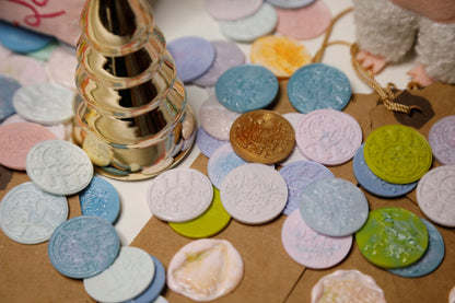 Soft pink wax seal stickers with Christmas-themed stamps on festive background