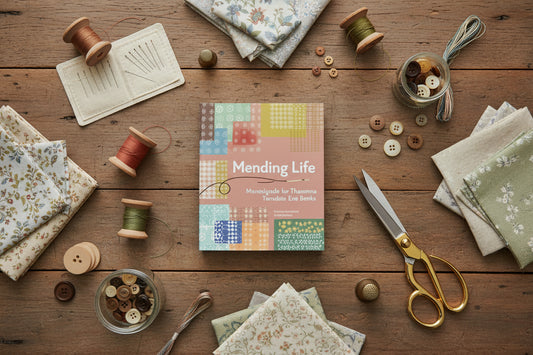 Book cover of 'Mending Life' with colorful patterns and text.