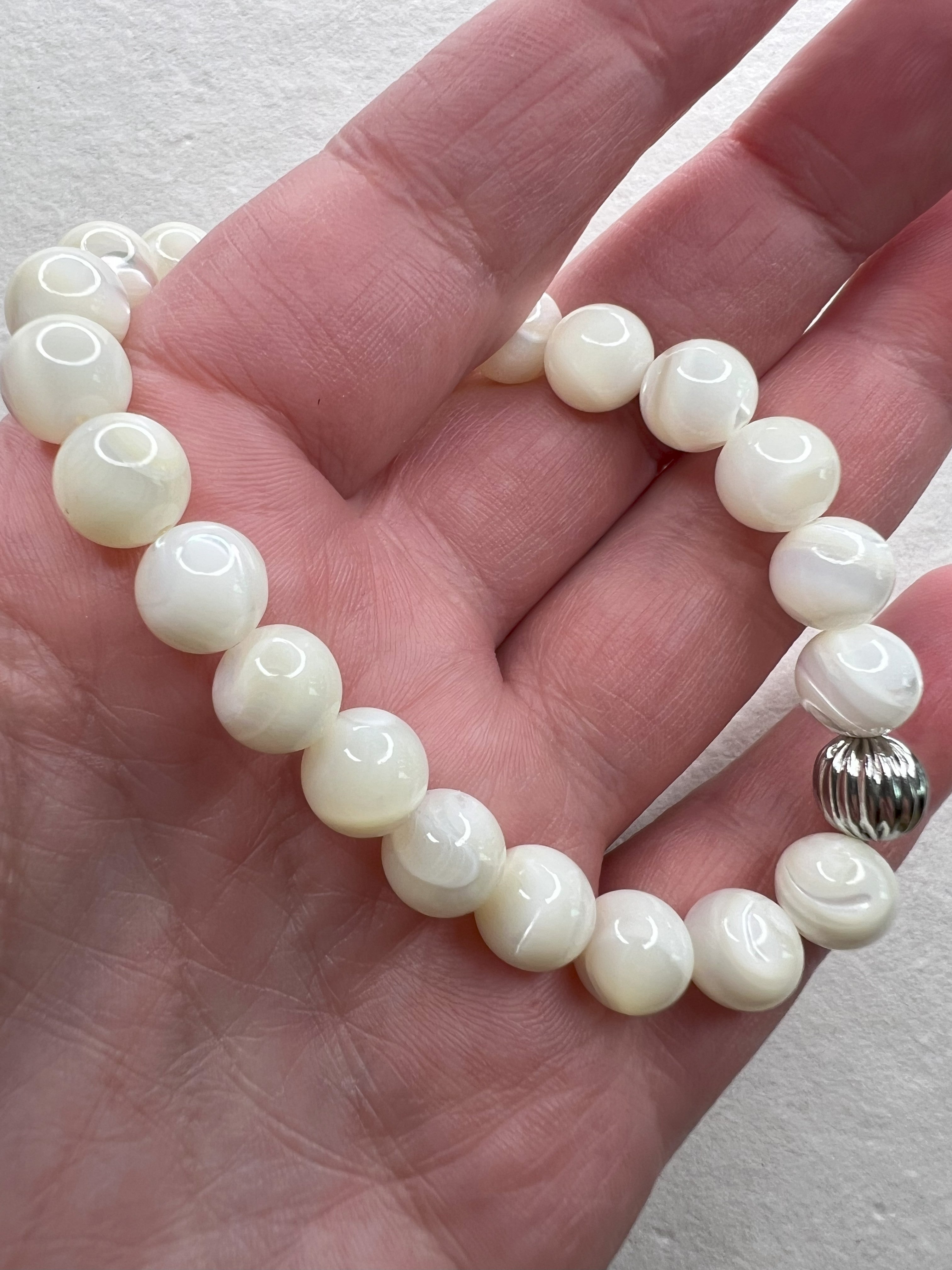 Close-up of gemstone bead texture and stainless steel accent bead