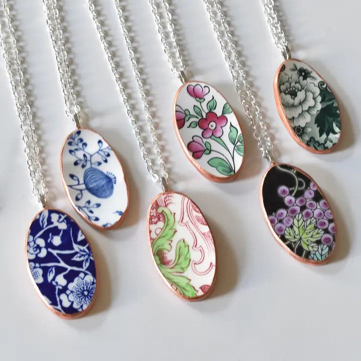 From Left to Right: Blue & White Floral, White & Blue Floral, Red & Green Decorative, White & Pink Floral, Black & Purple Floral, & White & Green Floral vintage china necklaces with silver chain and rose gold trim