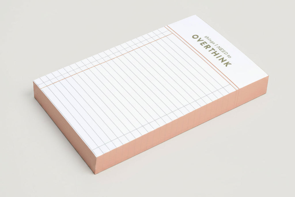 Grid notepad with 'things I Need to Overthink' statement on a white background