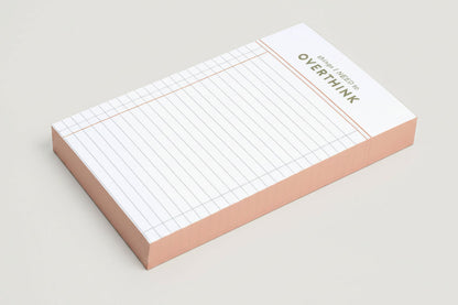 Grid notepad with 'things I Need to Overthink' statement on a white background