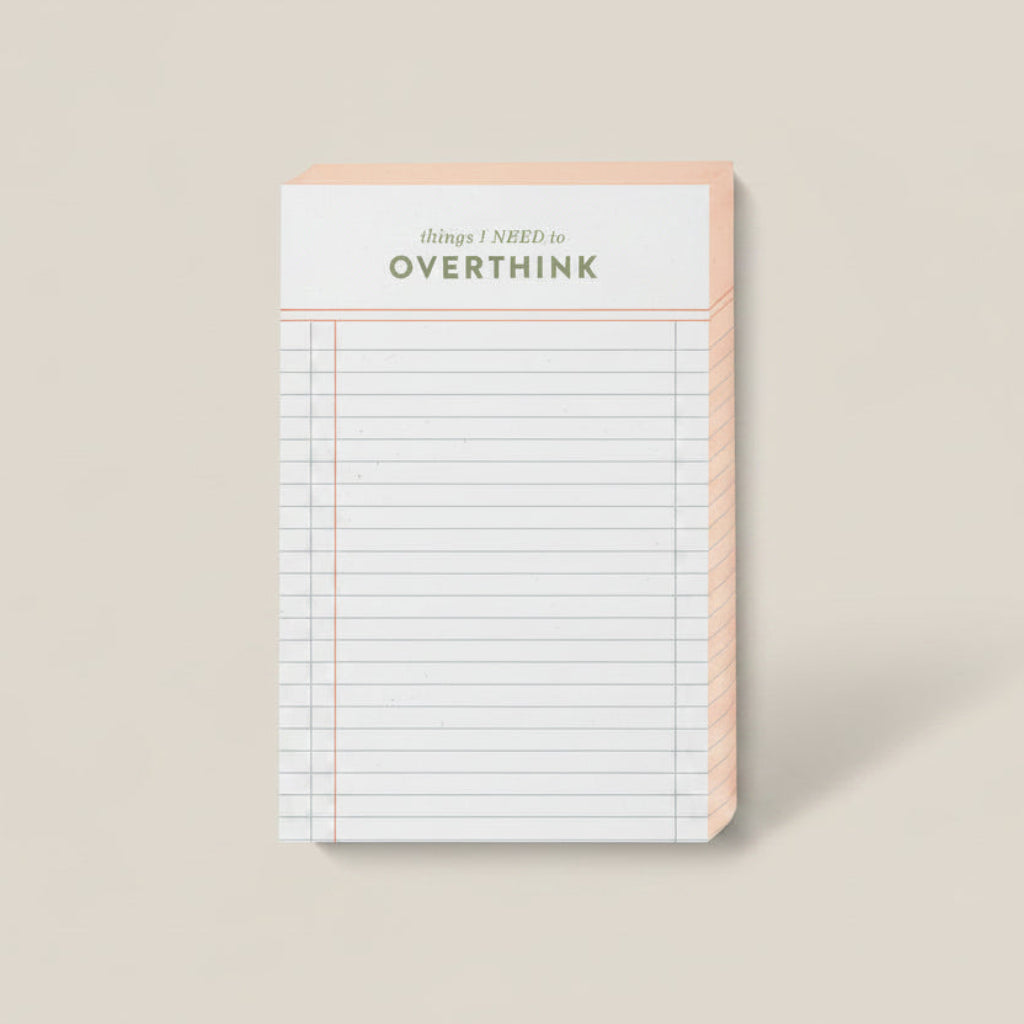 Notebook with 'Don't Overthink' text on a beige background