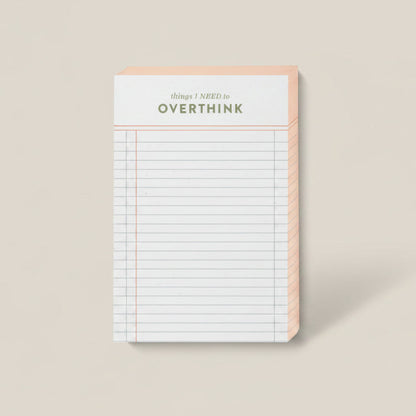 Notebook with 'Don't Overthink' text on a beige background