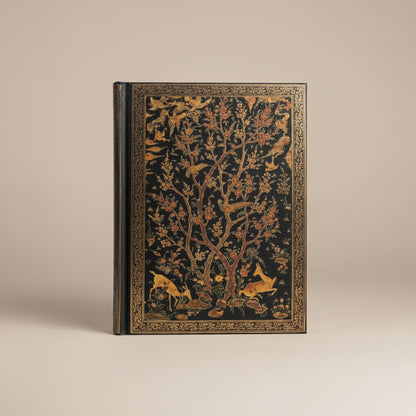 Image of the Persian Grove hardcover journal laying on a desk