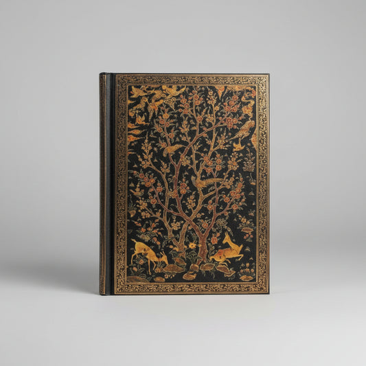 Image of the Persian Grove hardcover journal laying on a desk