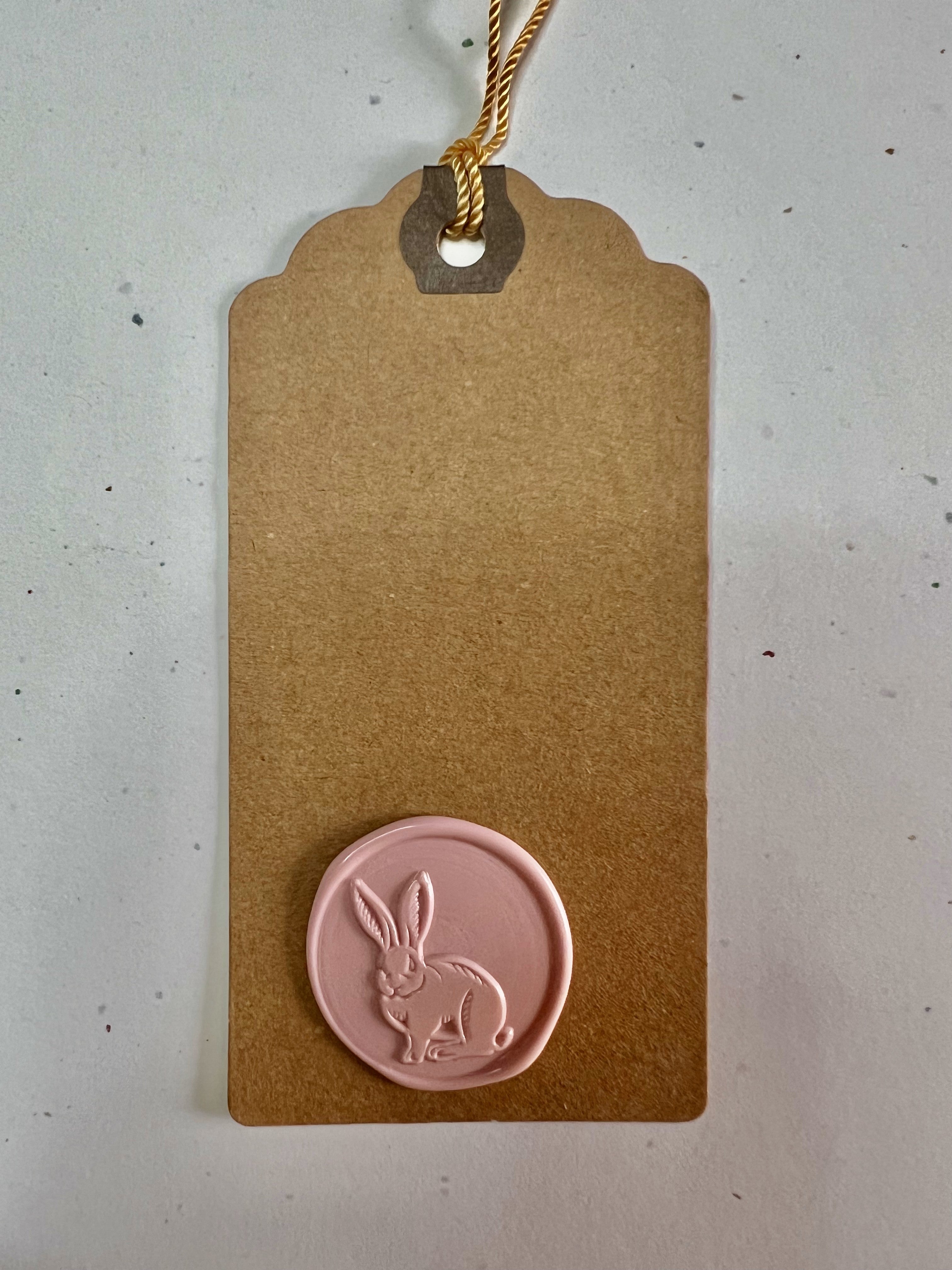 Coordinated Easter tags with vintage-style wax seals in bunny and floral designs for a timeless touch.