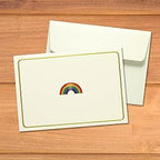 Close up view of the rainbow embossed notecard with self seal envelope