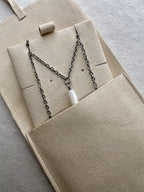 View of Mother of Pearl Drop Necklace in a soft suede cover