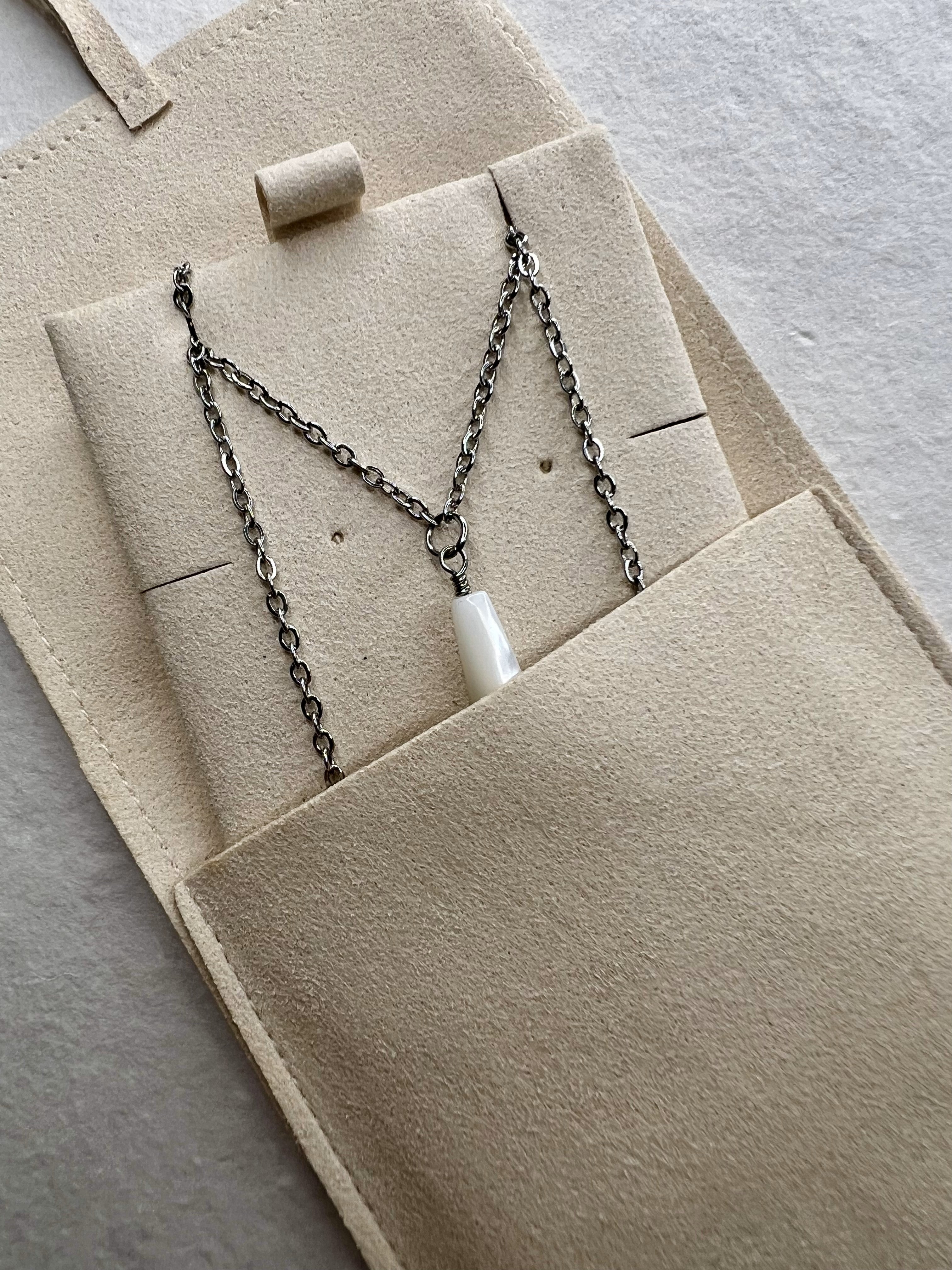 View of Mother of Pearl Drop Necklace in a soft suede cover