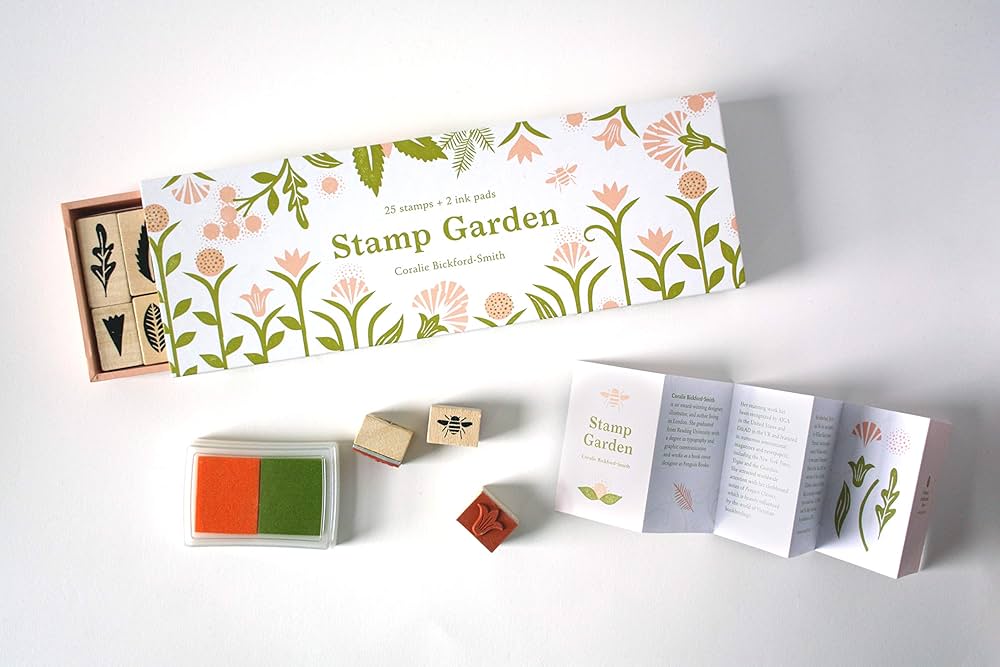 Botanical rubber stamp set in a matchbox-style box with floral illustrations and soft-toned ink pads