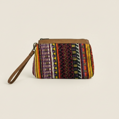 Festive striped fabric wristlet on a white background.