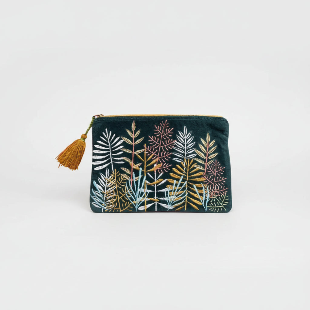 Embroidered pouch with leaf patterns and a tassel on a white background