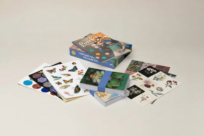 Collection of vintage-style sticker books on a gray background
