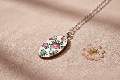 Necklace with a floral pendant on a light background