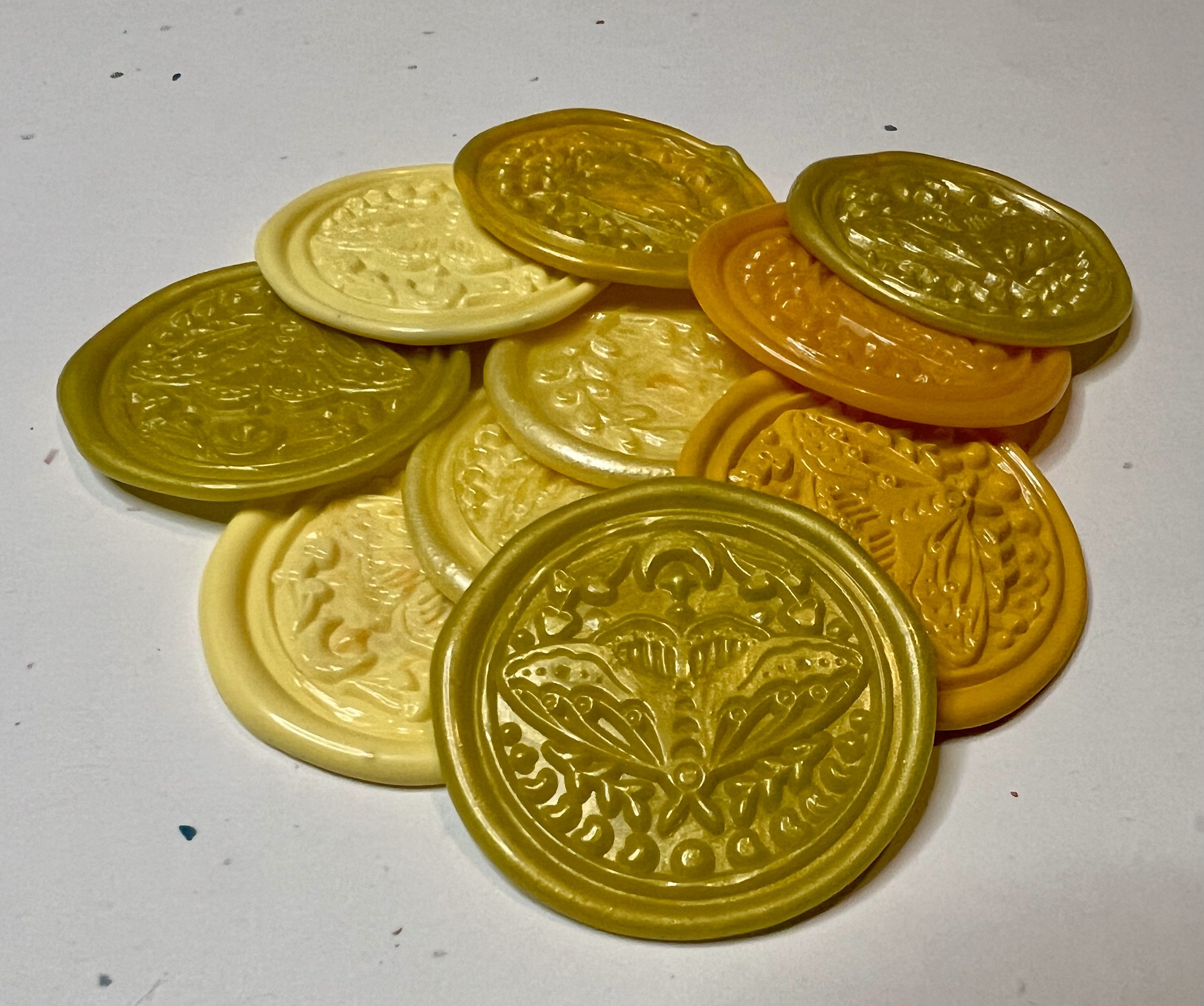 Yellow wax seal sticker with celestial moth details, perfect for adding light and wonder to crafts