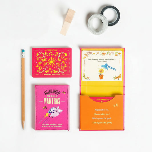 Colorful affirmation cards with a pencil on a white background