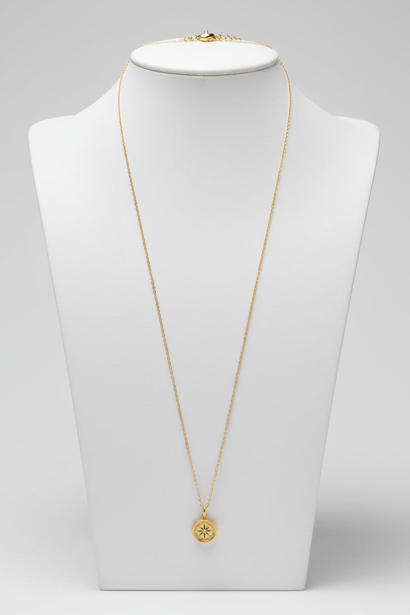 Gold necklace with a pendant on a white background