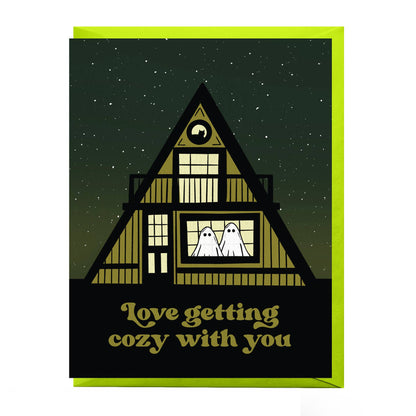 Illustration of a cozy A-frame cabin on the "Cozy Love Greeting Card"