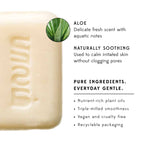 Bar of soap with branding and aloe vera information on a white background