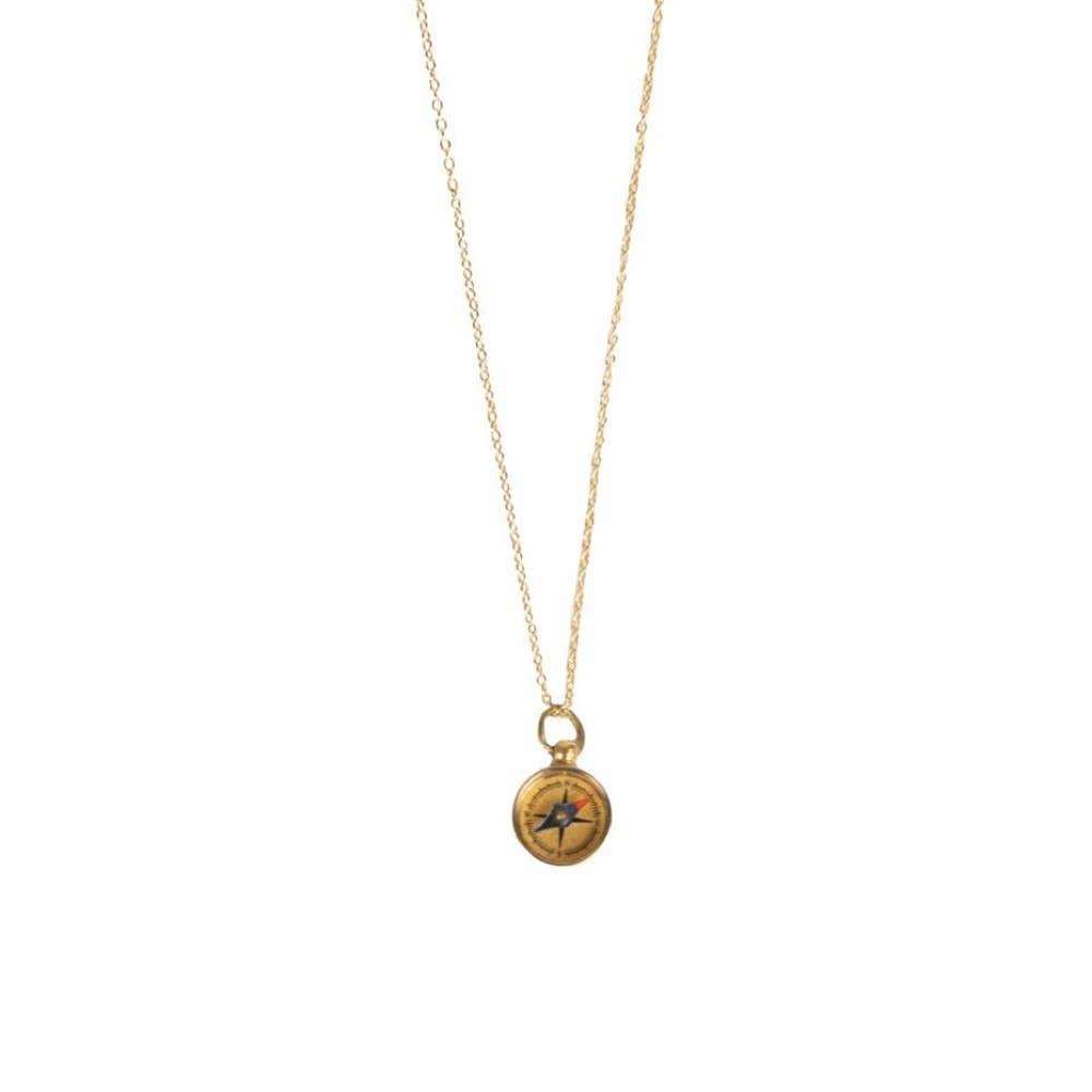 Gold necklace with a compass pendant on a white background
