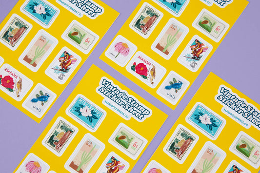 Flatlay of vintage postage stamp stickers on a kraft background
