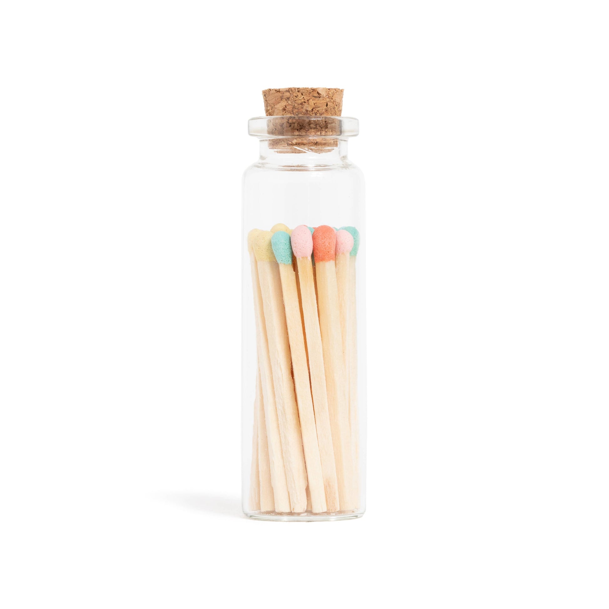 Pastel-colored matchsticks in a corked glass vial with an adhesive match striker at the bottom.