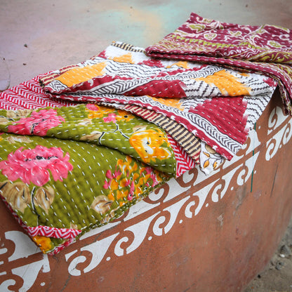 Colorful patterned fabrics on a textured surface