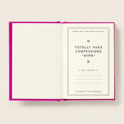 Open mini journal with a pink cover displaying text about 'Totally Fake Confessions' on a beige background.
