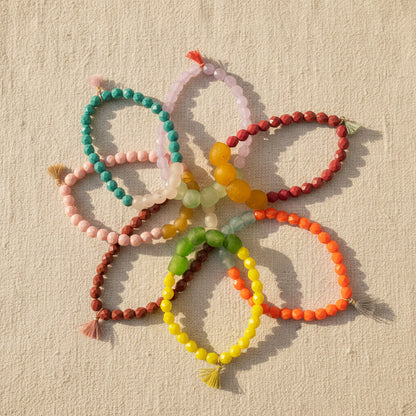 Colorful Czech glass beaded bracelets on a neutral background